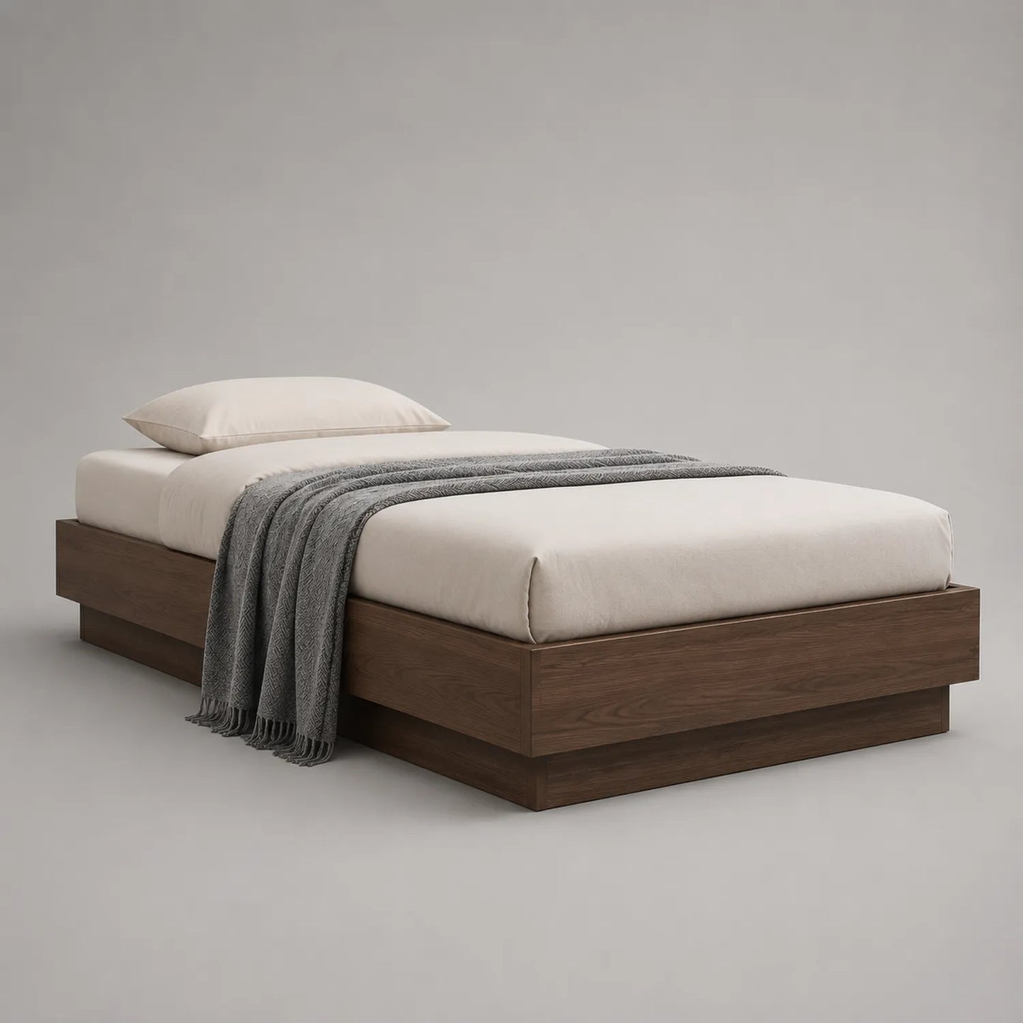 Einzelbett aus Holz mit Matratze und Kissen
